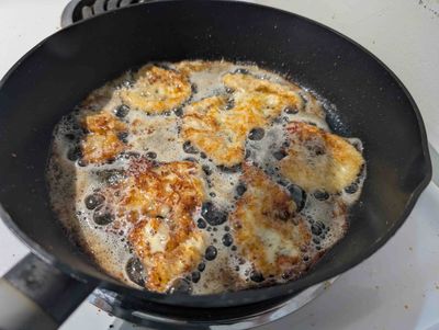 Photo of fried scamorza in the frying pan with nice dark colours