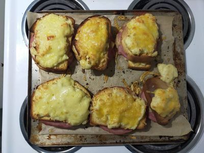Photo of six toasted croque monsieurs on an oven tray. Yum!