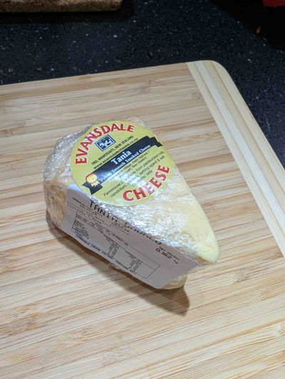 Photo of the Evansdale smoked brie. It is triangular and a creamy yellow