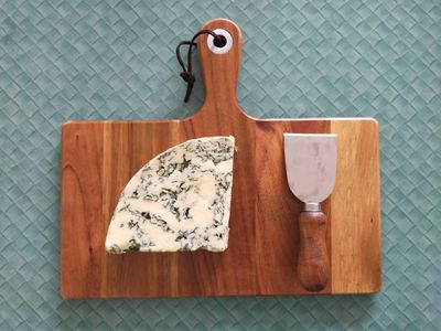 A photo of blue monkey cheese on a cheeseboard